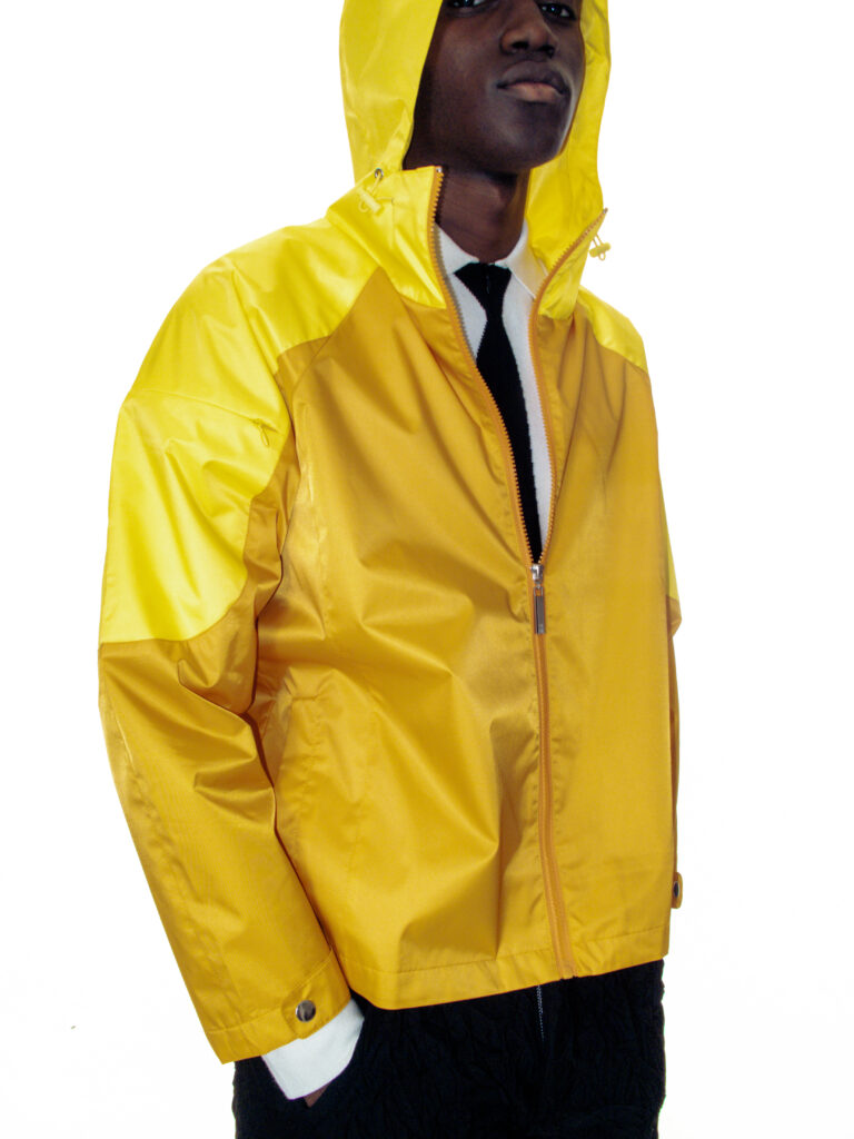 Spencer Badu Wearing A Yellow coat