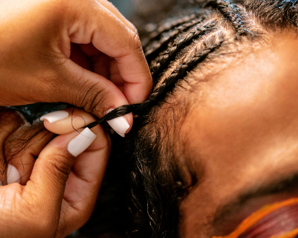 A stylist making Fulani Braids