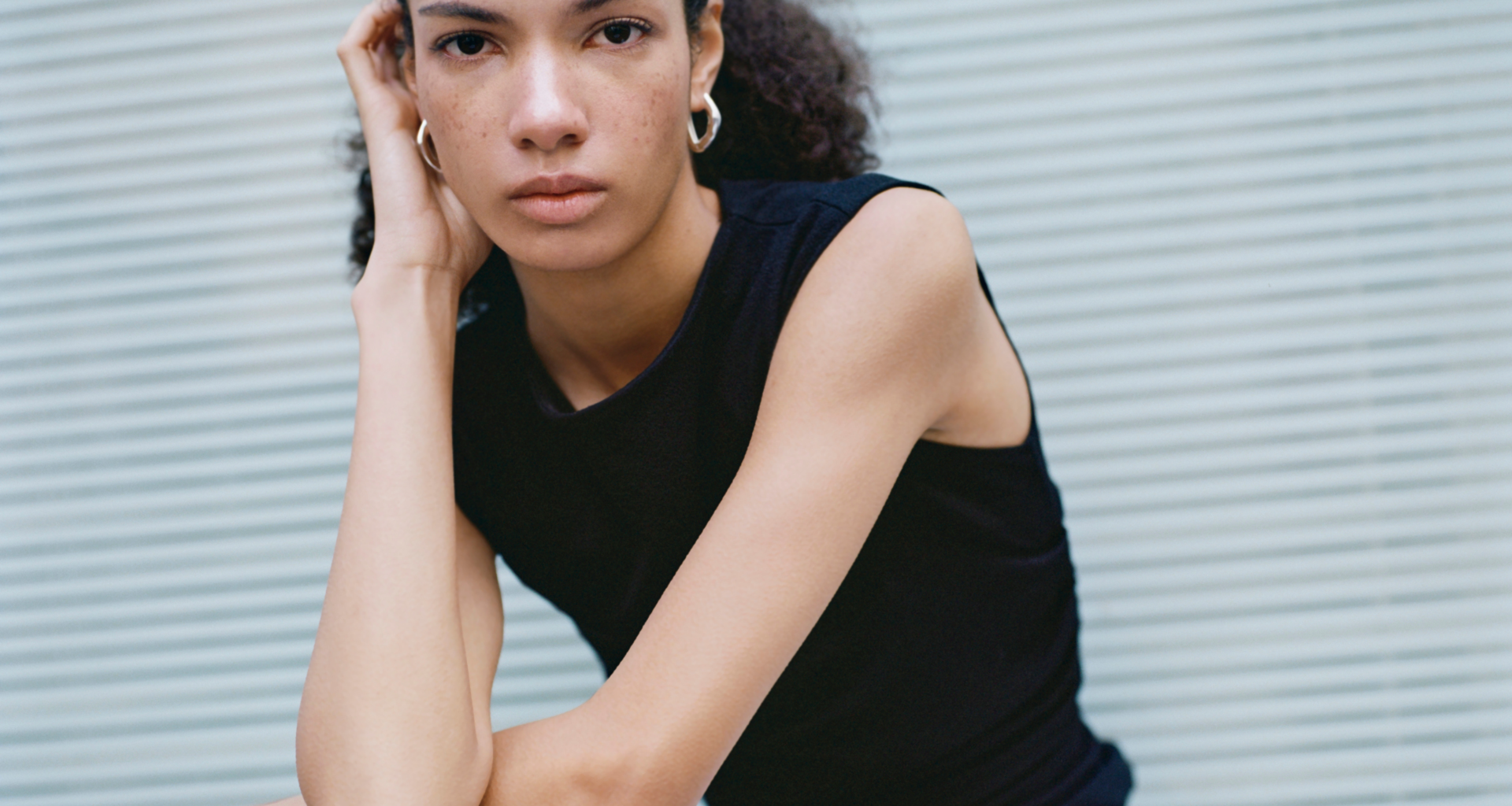 A model wearing ESSĒN The Label Jewellery Collection 