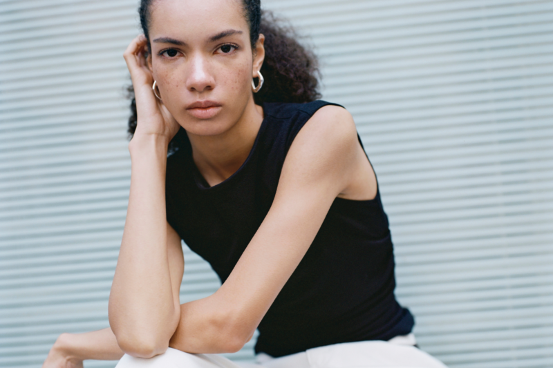 A model wearing ESSĒN The Label Jewellery Collection
