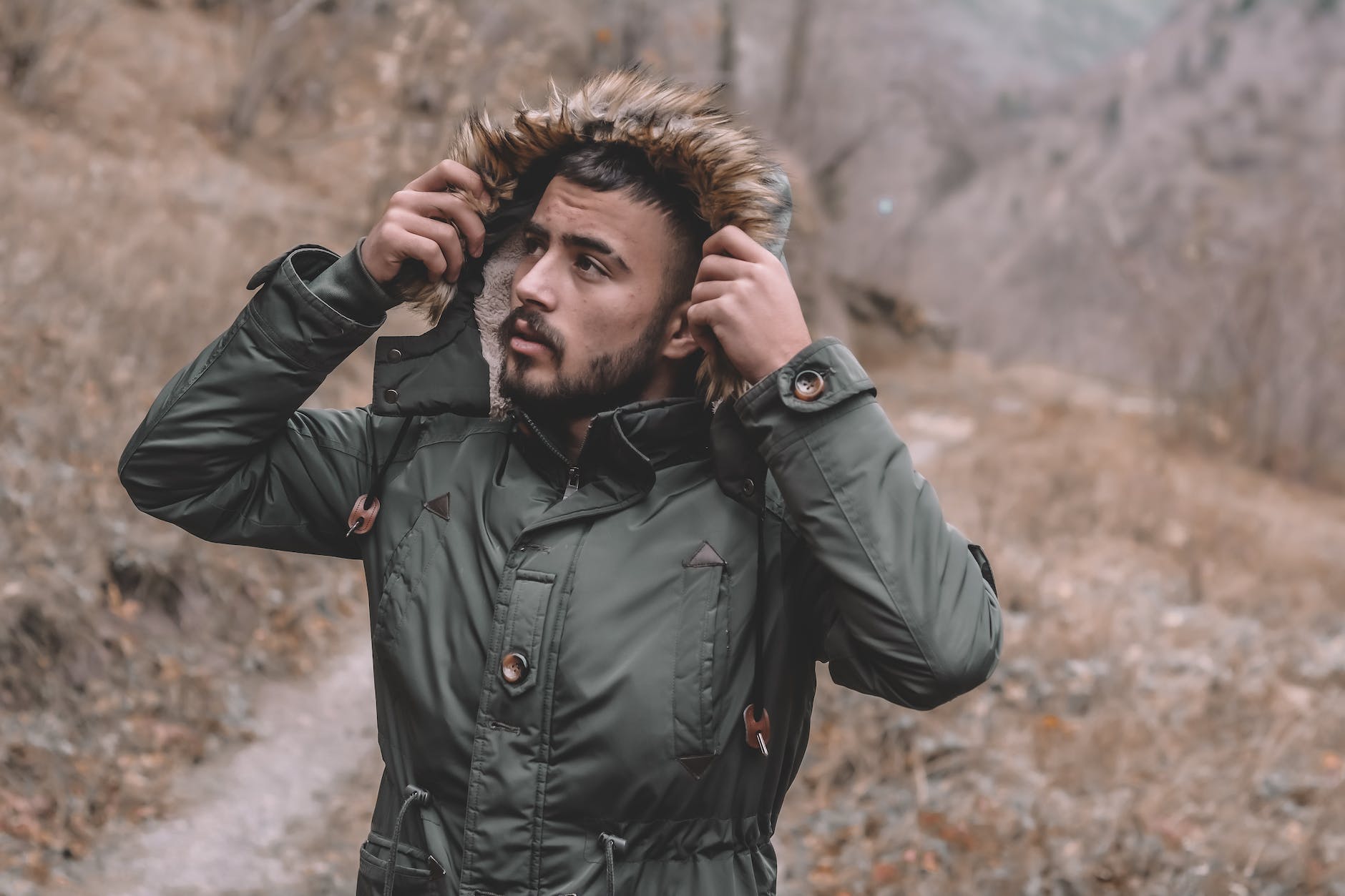man wearing green jacket