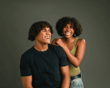 A girl and a guy with curly hair