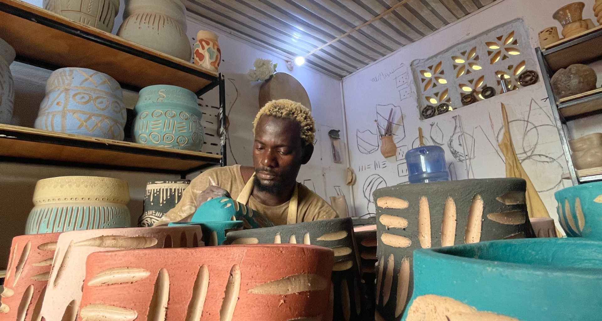 Idris Olabode, Clay of Lagos in his studio making ceramics