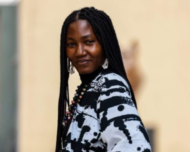 Ayoola Omovo wearing a black and white cloth