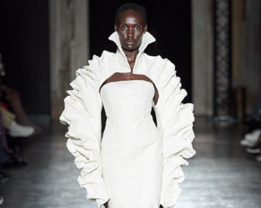 Evocative scene from Han Kjøbenhavn's SS24 show, highlighting the unlightened particles, at Milan Fashion Week