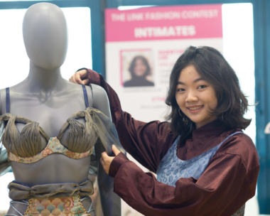 Shertienne Lee surrounded by environmentally sustainable fabric choices, showcasing her deep-rooted ethical approach to fashion design