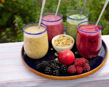 Colorful assortment of post-workout smoothies, each designed to boost recovery and wellness