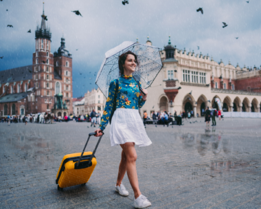 Solo traveler with a bag overlooking a majestic building, embodying the essence of getting the most out of a solo getaway
