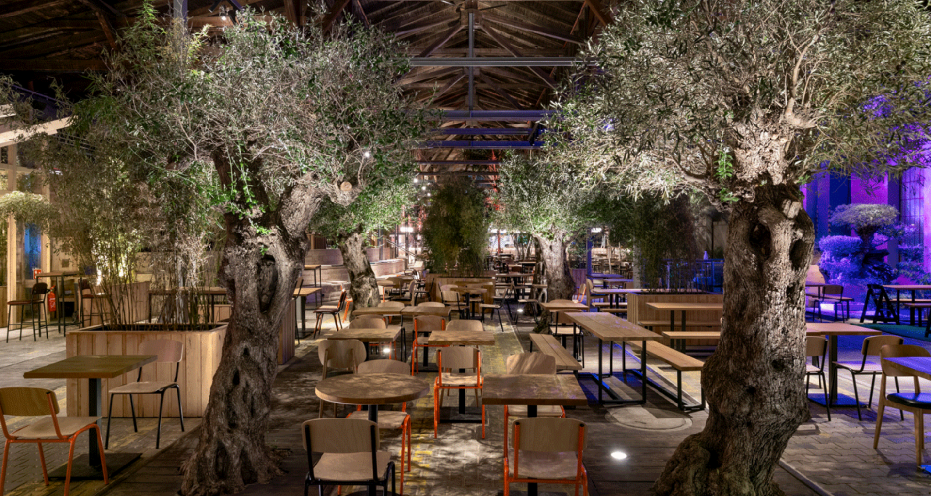 Inside Gleisgarten, showcasing the diverse gastronomic stalls and vibrant atmosphere of Vienna's first food hall.