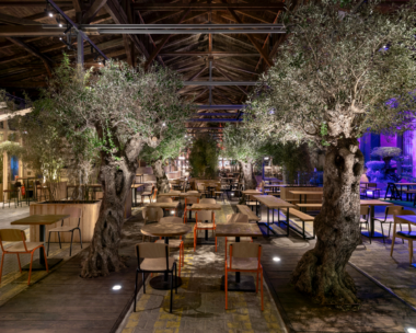 Inside Gleisgarten, showcasing the diverse gastronomic stalls and vibrant atmosphere of Vienna's first food hall.