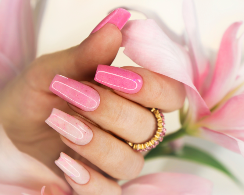 Elegant spring-themed classic nail art ideas for March, including floral and pastel patterns