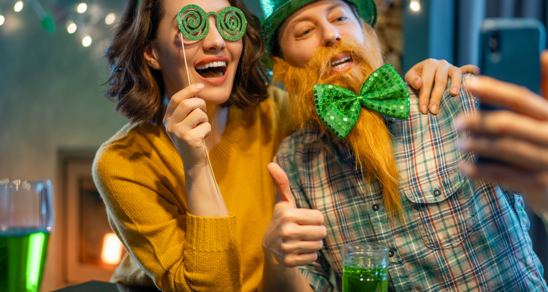 Table set for St. Patrick's Day feast with green-themed dishes and shamrock decorations