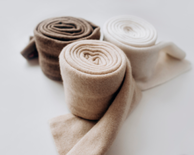 Close-up of soft, high-quality cashmere wool on display, emphasizing its role in the luxury fabric industry and origin in Mongolia
