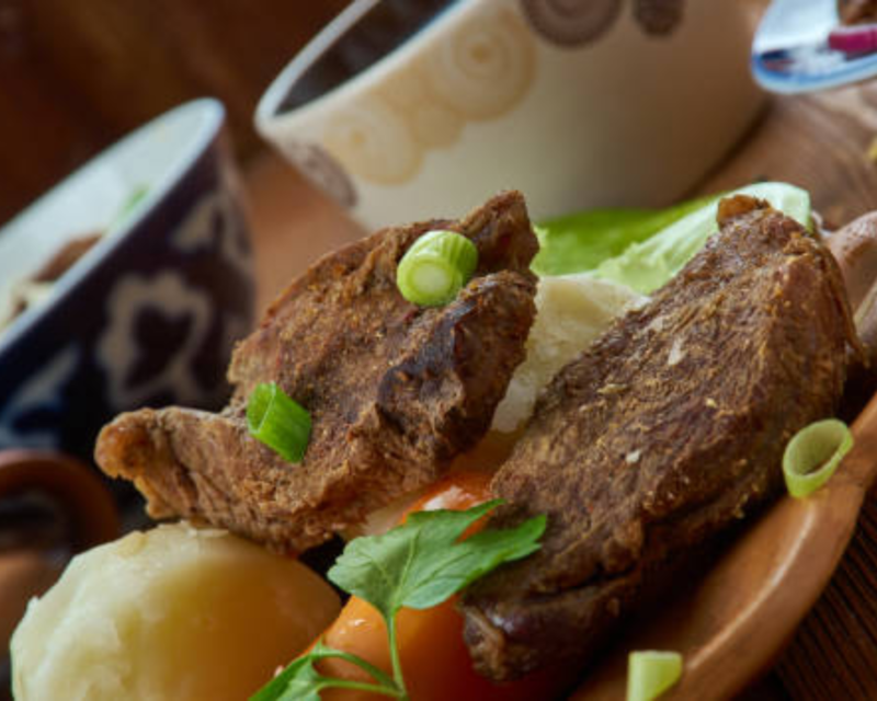 A plate of succulent Mongolian Khorkhog beef showcasing why Mongolia produces the best meat in the world.