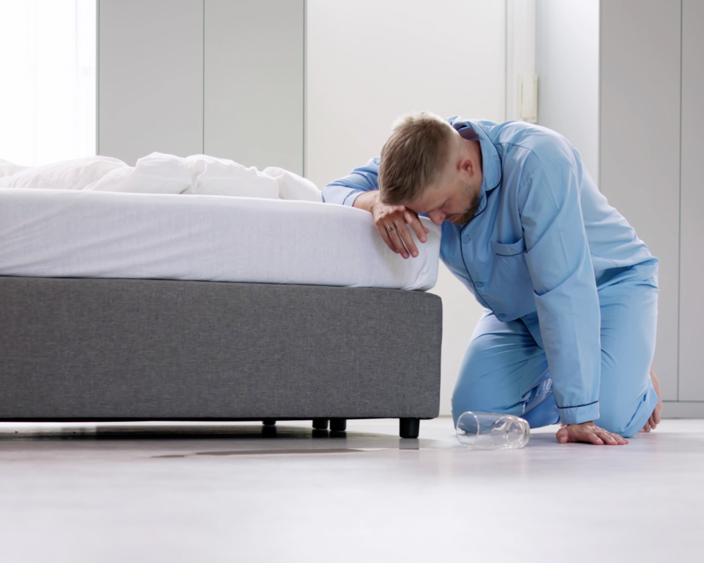 A dizzy man in pyjamas