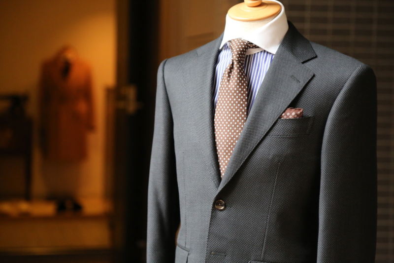 Elegant men's summer suit displayed, ideal for formal occasions during the hotter months.
