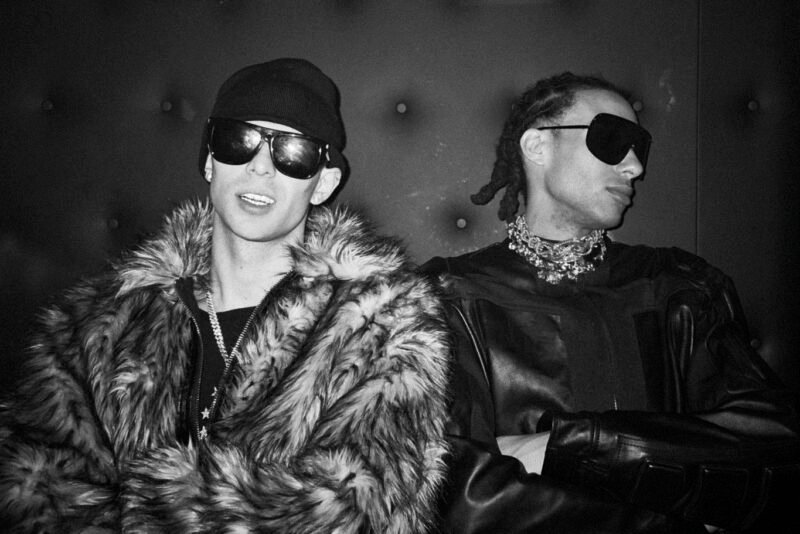 Music artists Uneek Flow and Cledos in a dynamic urban setting, photo by Jesse Koch