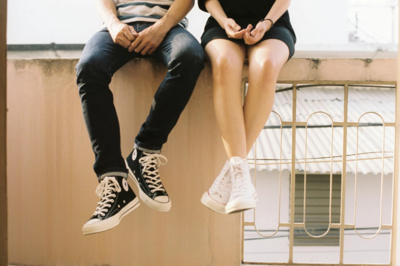 Close-up of a male and female sitting down in a romantic manner