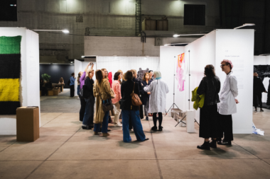 Visitors exploring fashion and art installations at FASHION POSITIONS 2024.