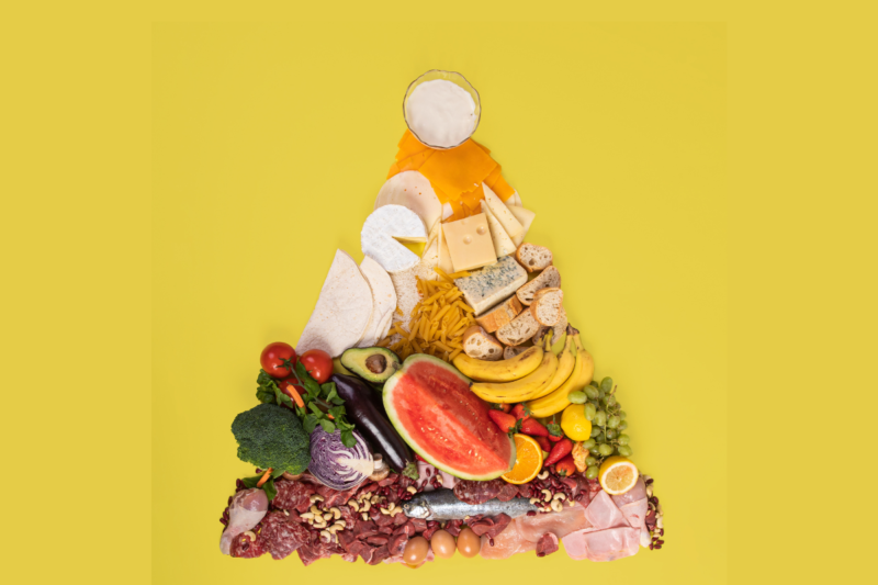 A balanced meal featuring lean protein, whole grains, and colorful vegetables on a plate, symbolizing healthy eating habits for men