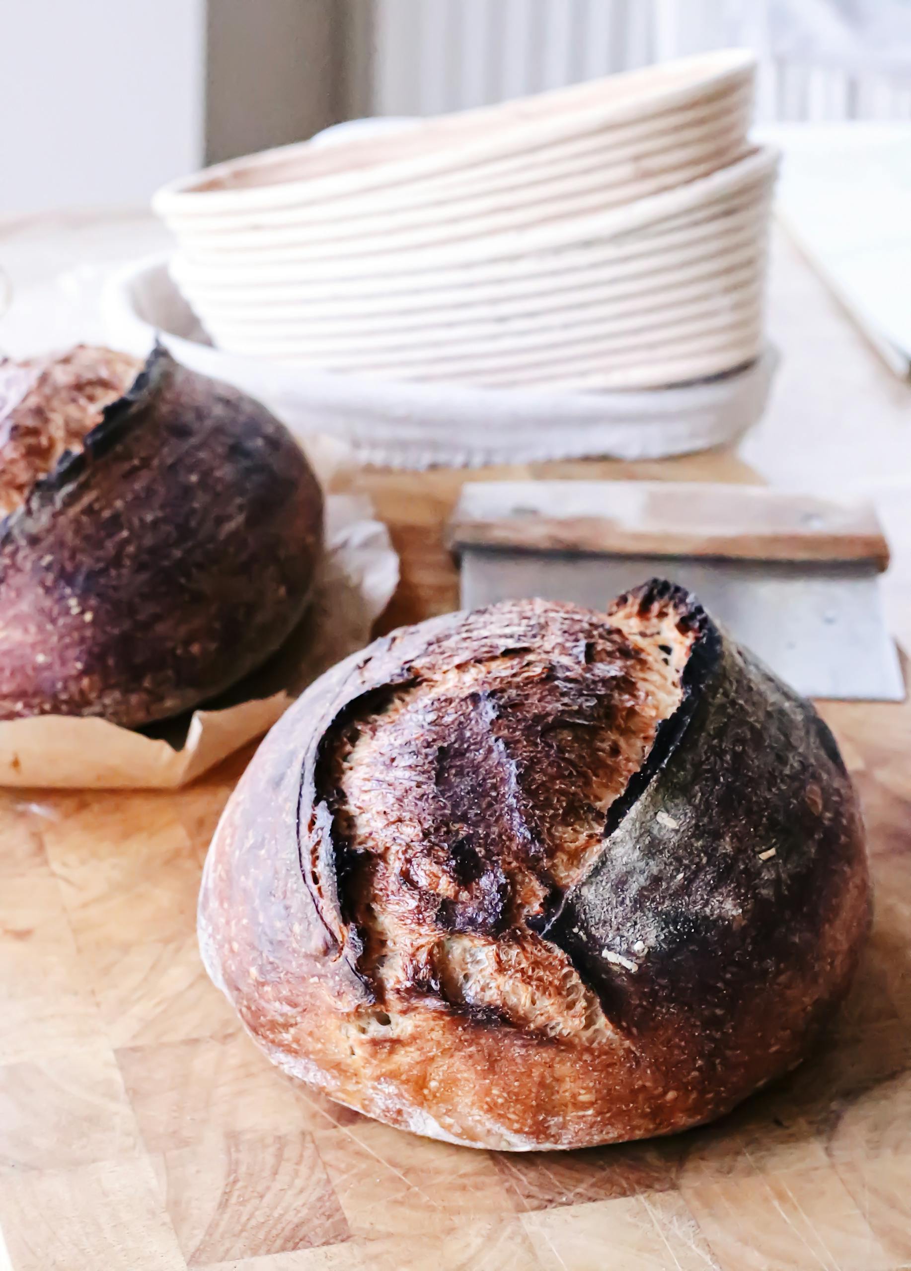 Sourdough bread with burnt crust on table
