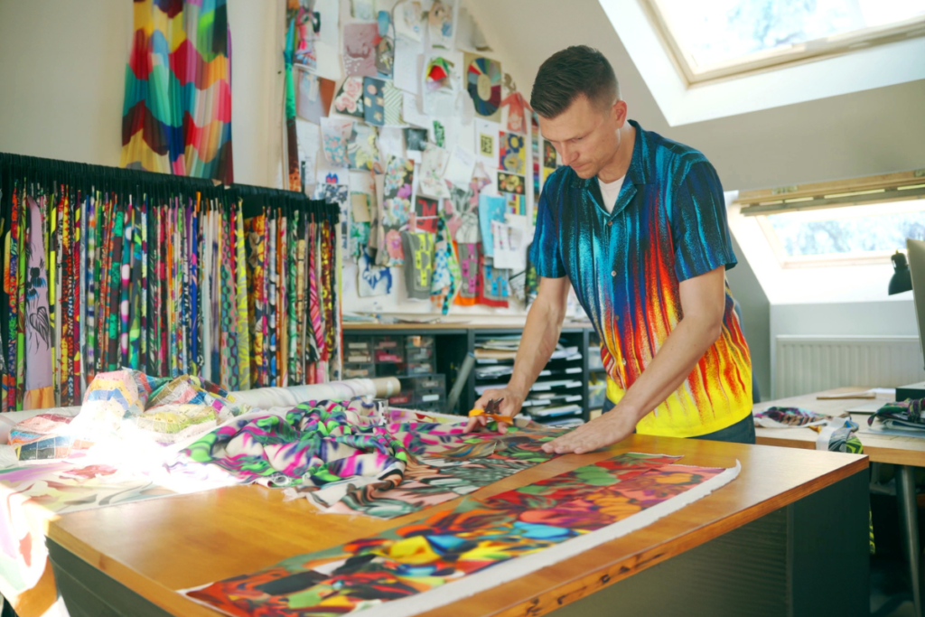 Juraj Straka working his his studion on bold fashion prints in a vibrant collection
