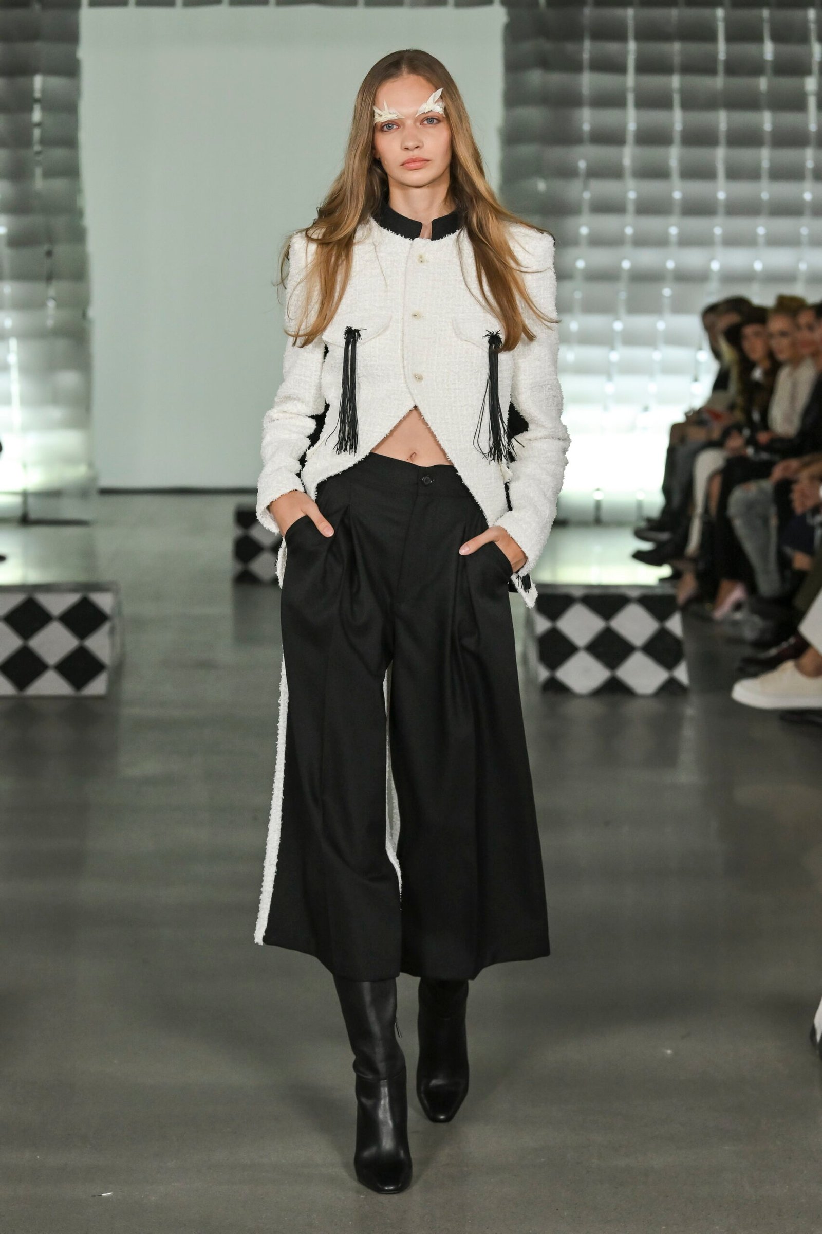 Pavol Dendis showcases circus-inspired collection FOOLS, combining precise tailoring with innovative patterns at MB Fashion Live.