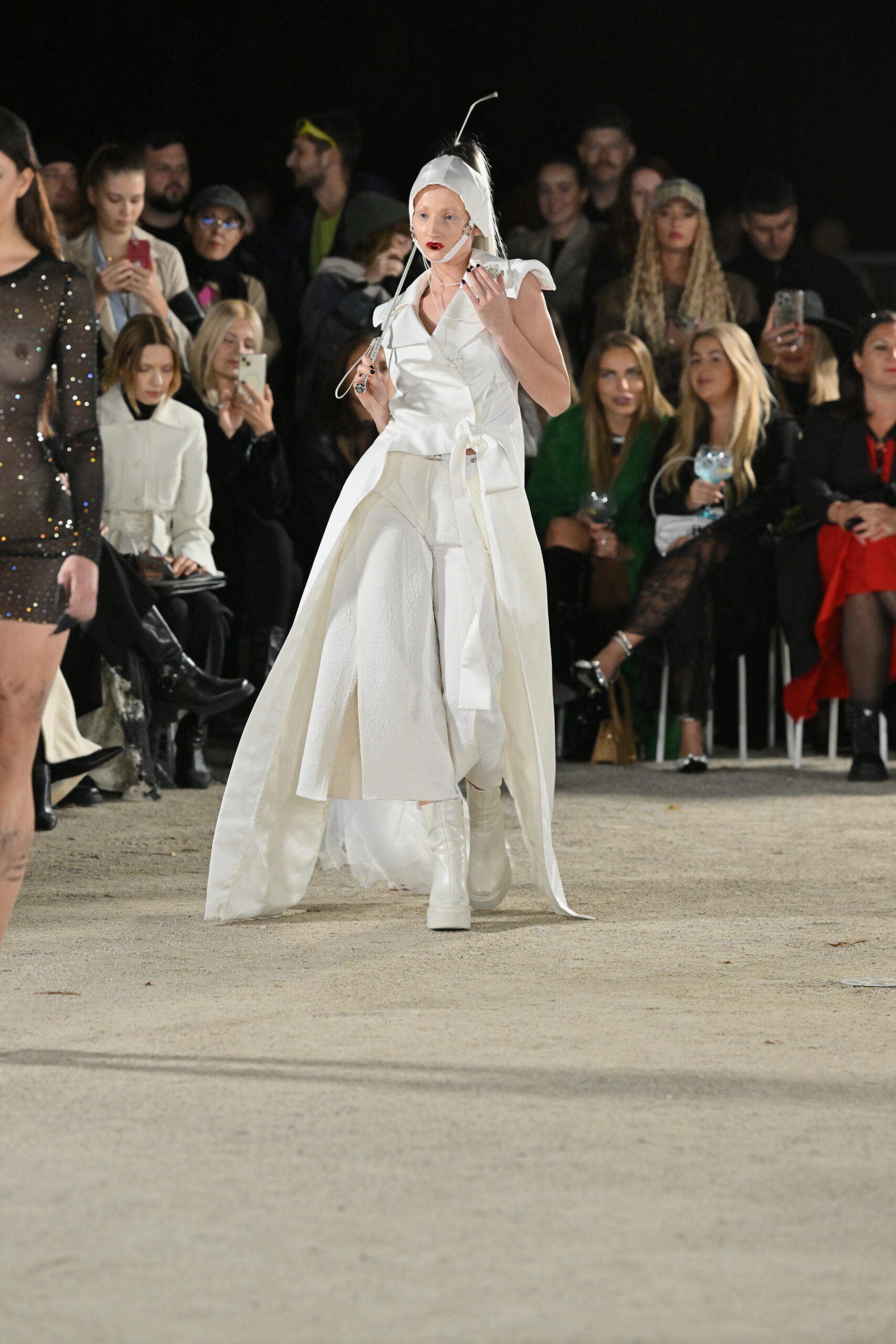 Models on a chessboard-inspired runway during Mercedes-Benz Fashion Live! 2024