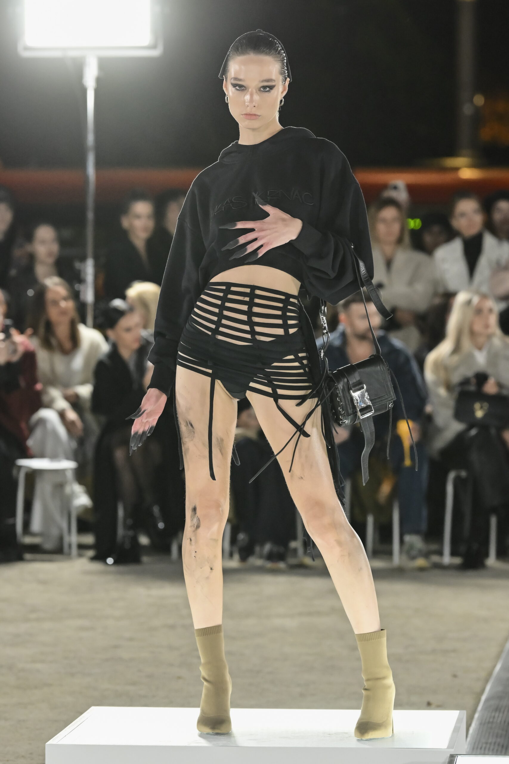 Models on a chessboard-inspired runway during Mercedes-Benz Fashion Live! 2024