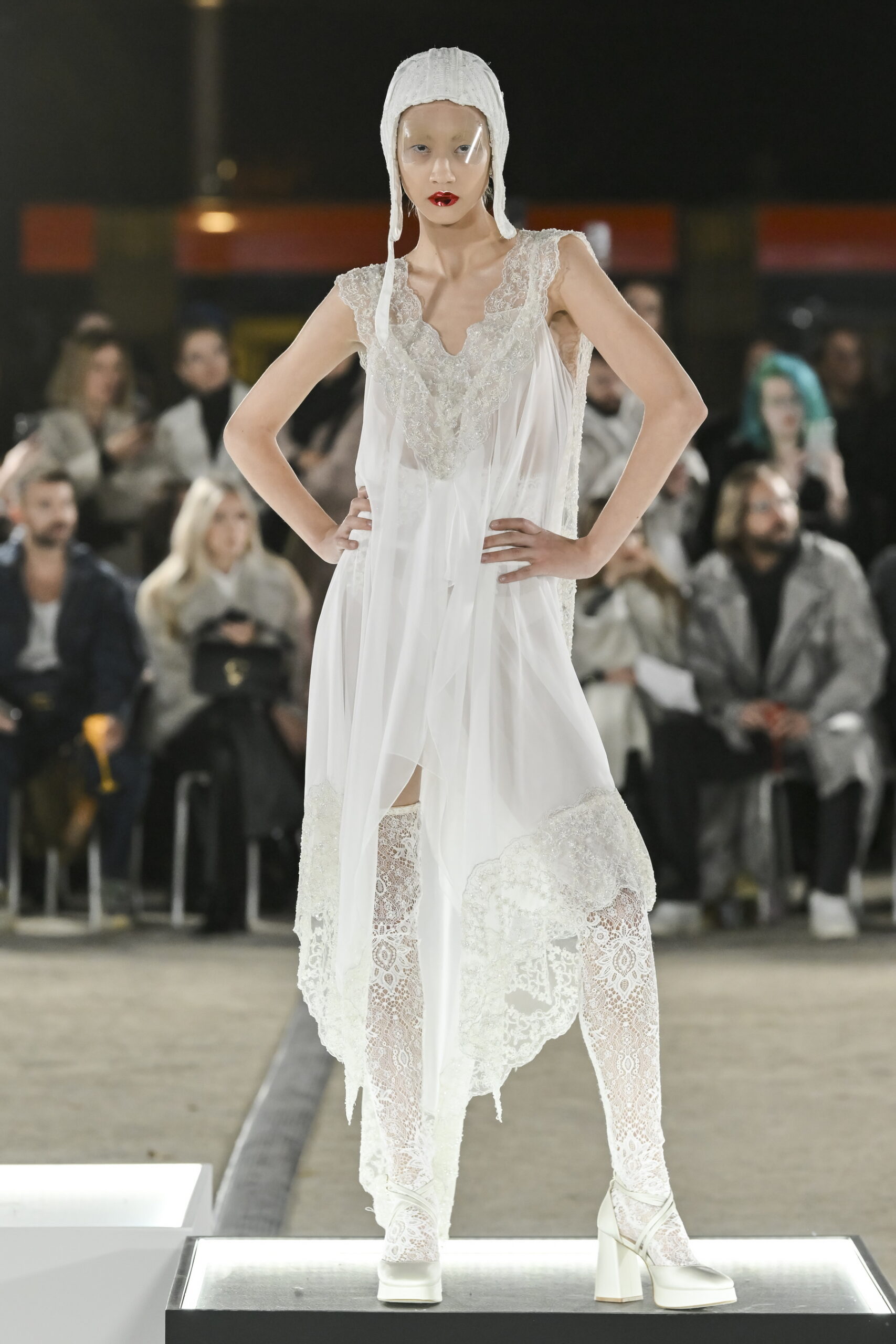 Models on a chessboard-inspired runway during Mercedes-Benz Fashion Live! 2024