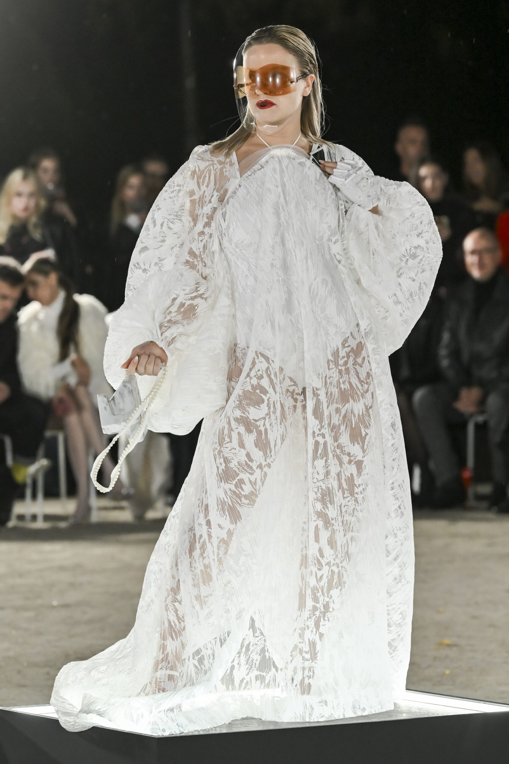 Models on a chessboard-inspired runway during Mercedes-Benz Fashion Live! 2024