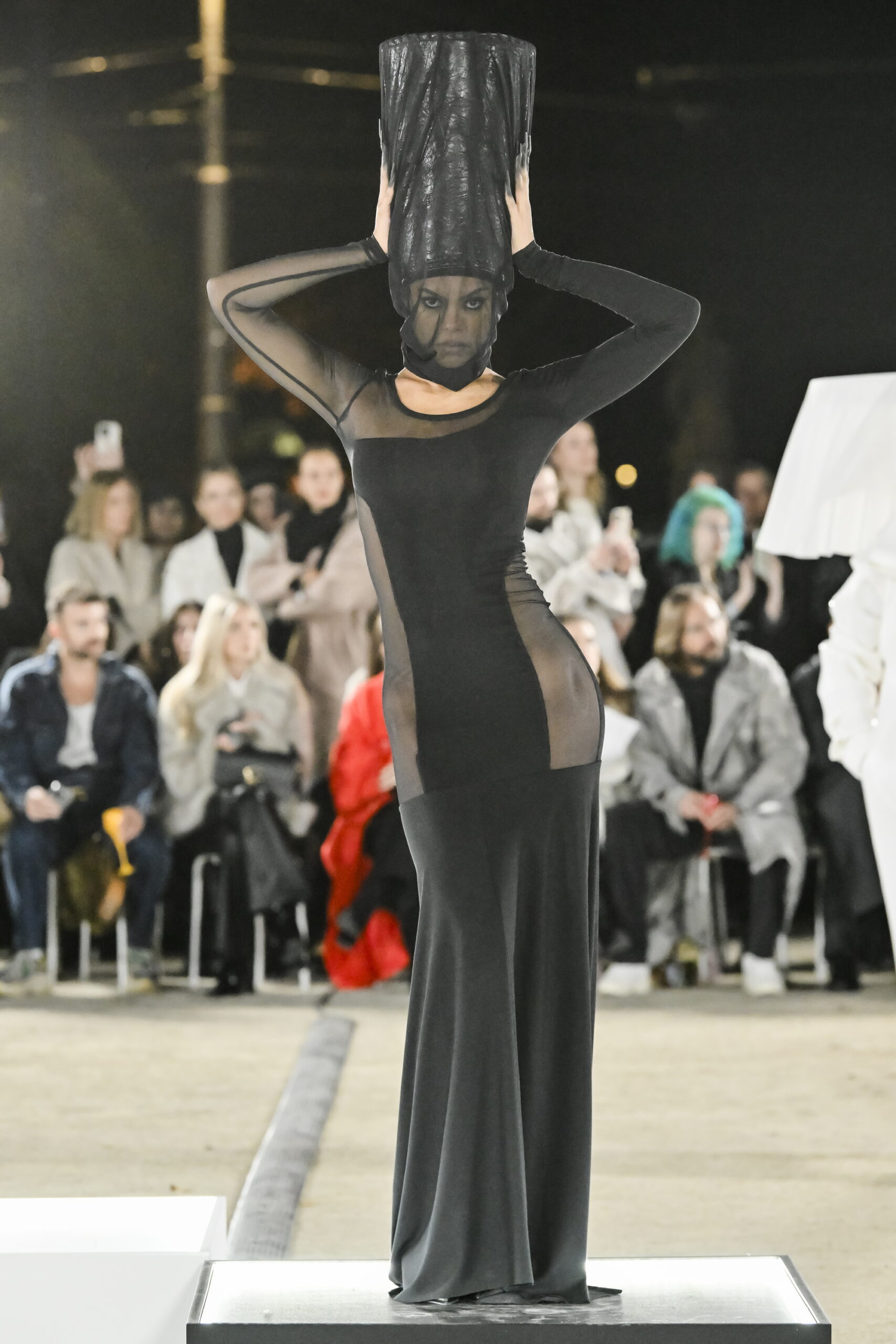 Models on a chessboard-inspired runway during Mercedes-Benz Fashion Live! 2024