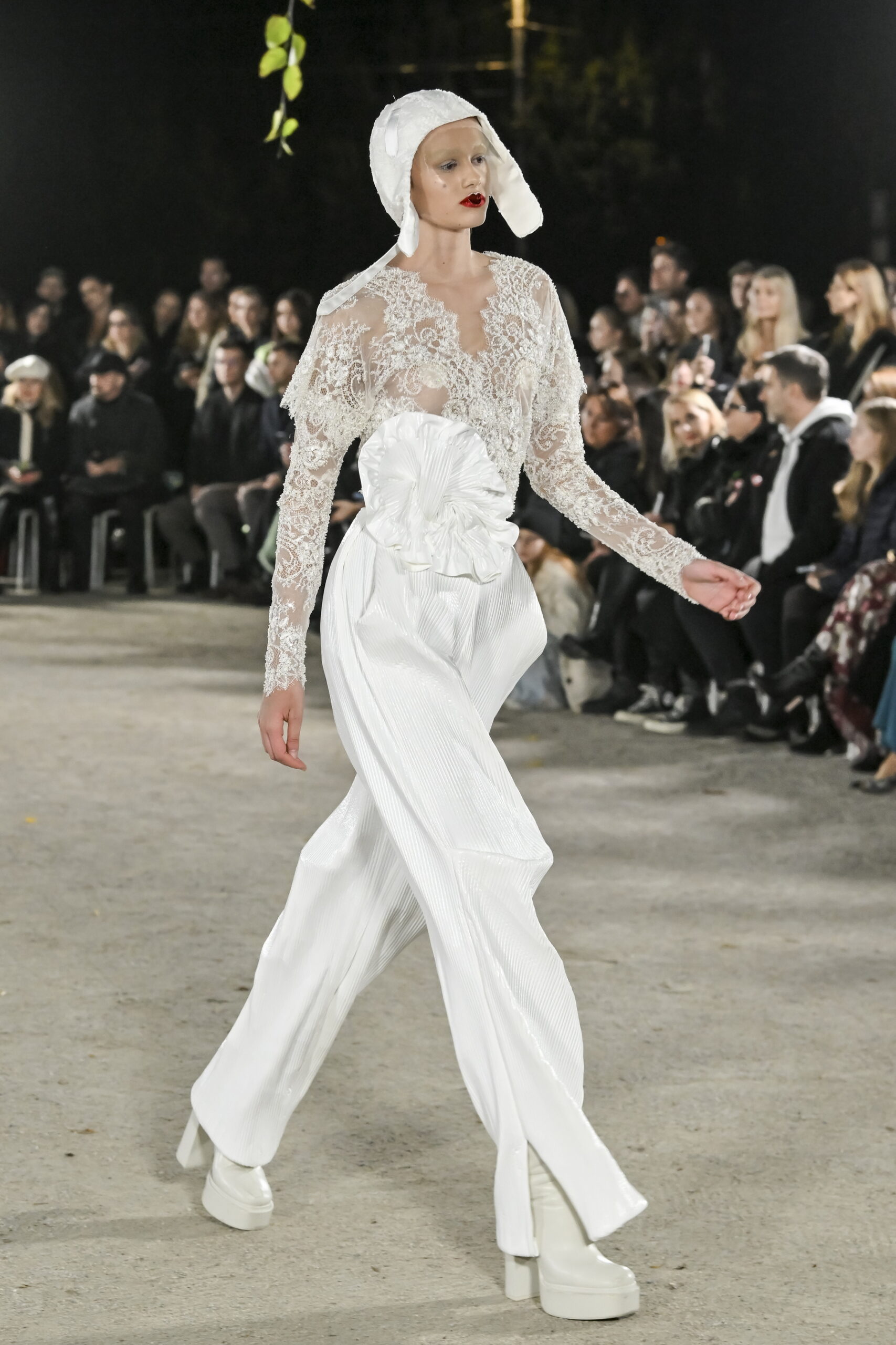 Models on a chessboard-inspired runway during Mercedes-Benz Fashion Live! 2024