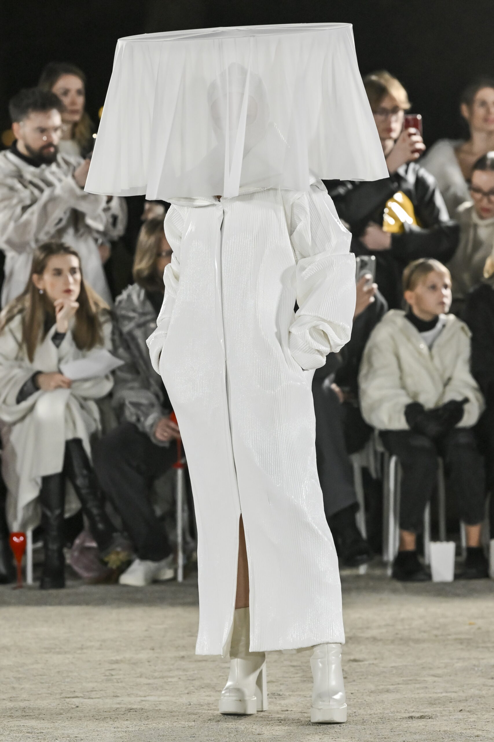 Models on a chessboard-inspired runway during Mercedes-Benz Fashion Live! 2024