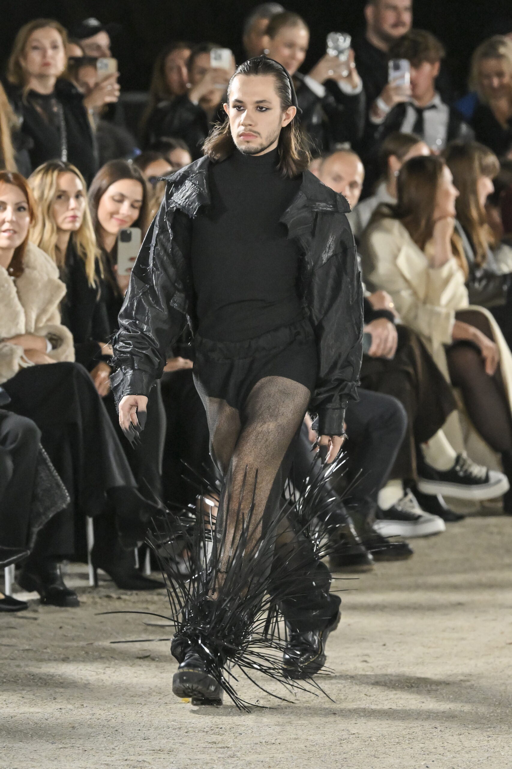 Models on a chessboard-inspired runway during Mercedes-Benz Fashion Live! 2024