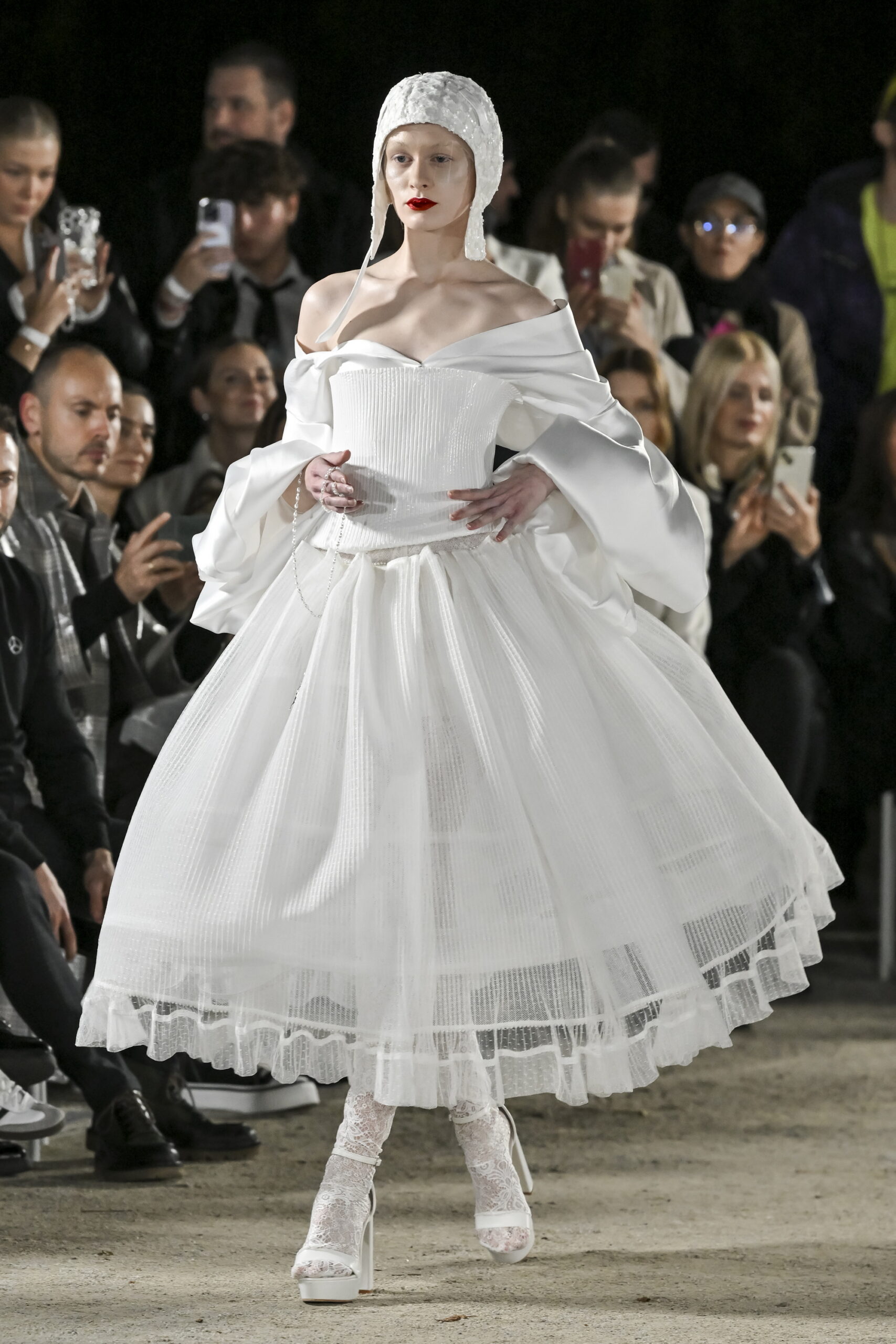 Models on a chessboard-inspired runway during Mercedes-Benz Fashion Live! 2024