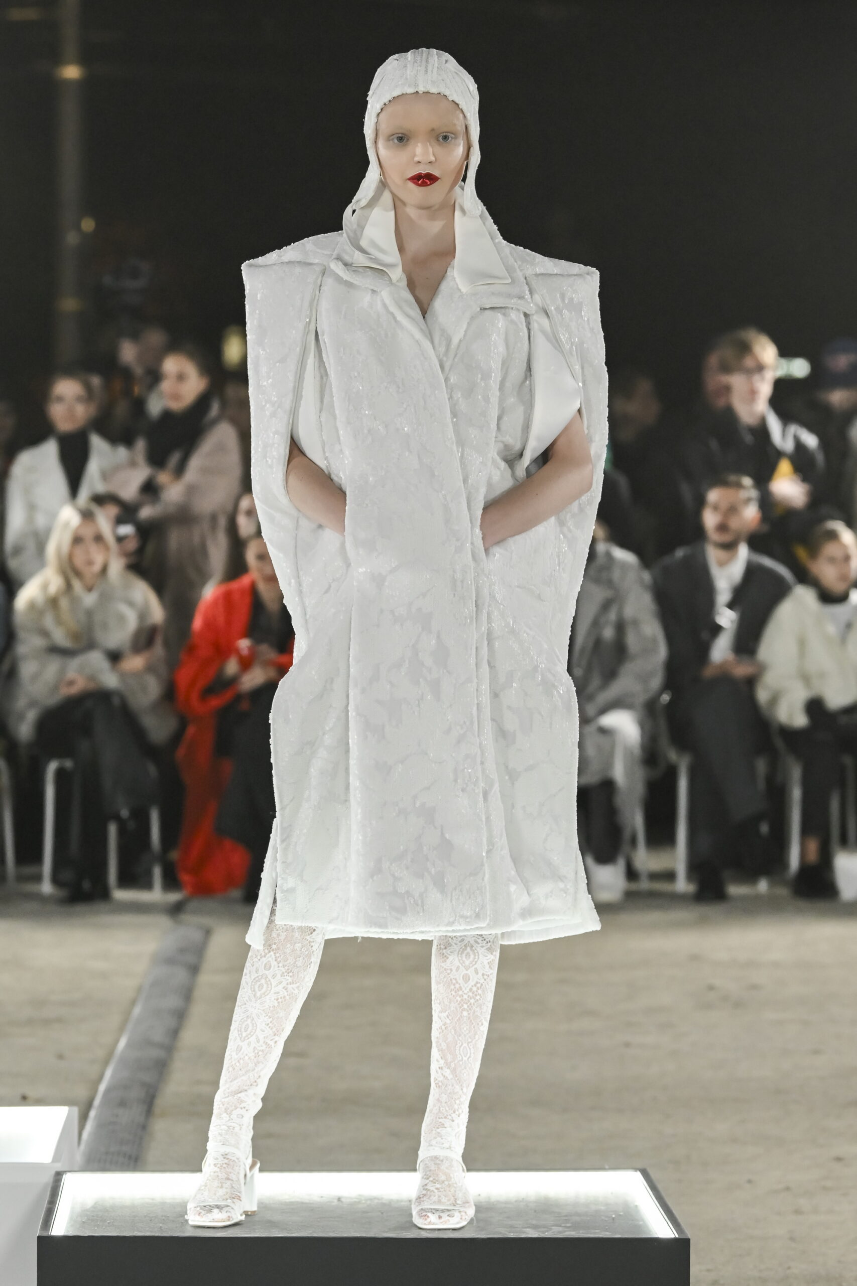 Models on a chessboard-inspired runway during Mercedes-Benz Fashion Live! 2024