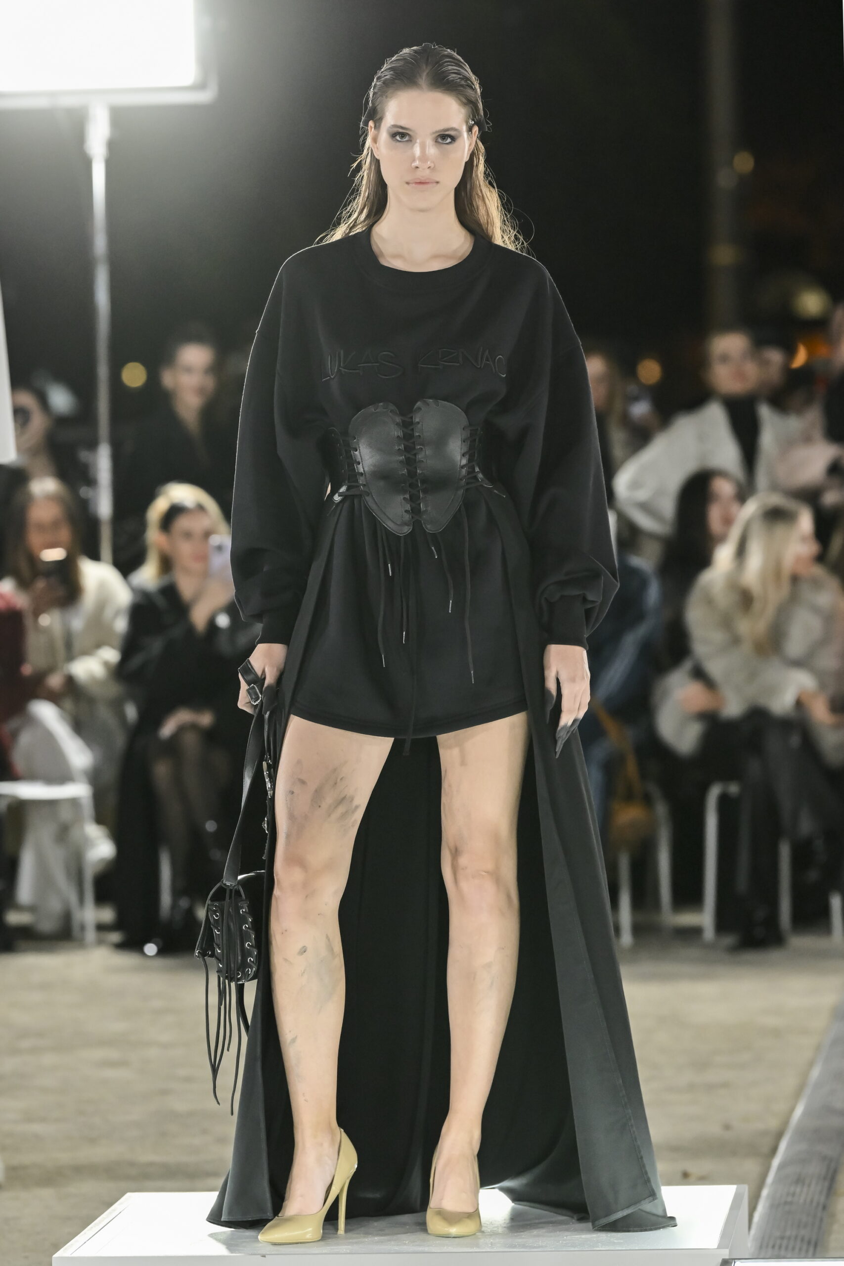 Models on a chessboard-inspired runway during Mercedes-Benz Fashion Live! 2024