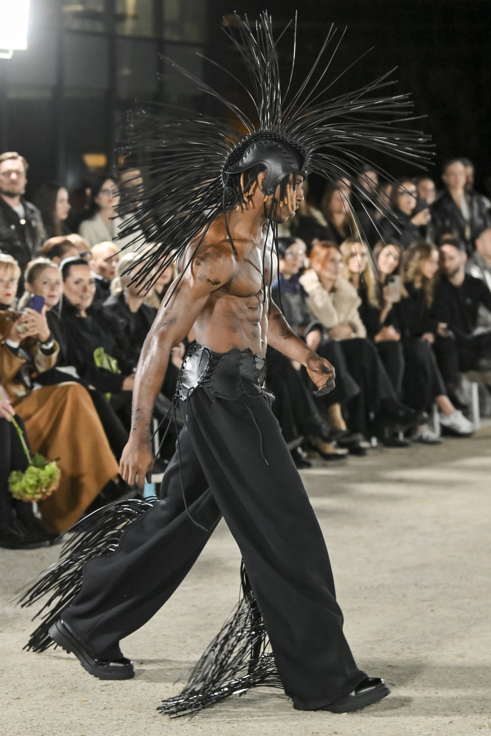 Models on a chessboard-inspired runway during Mercedes-Benz Fashion Live! 2024