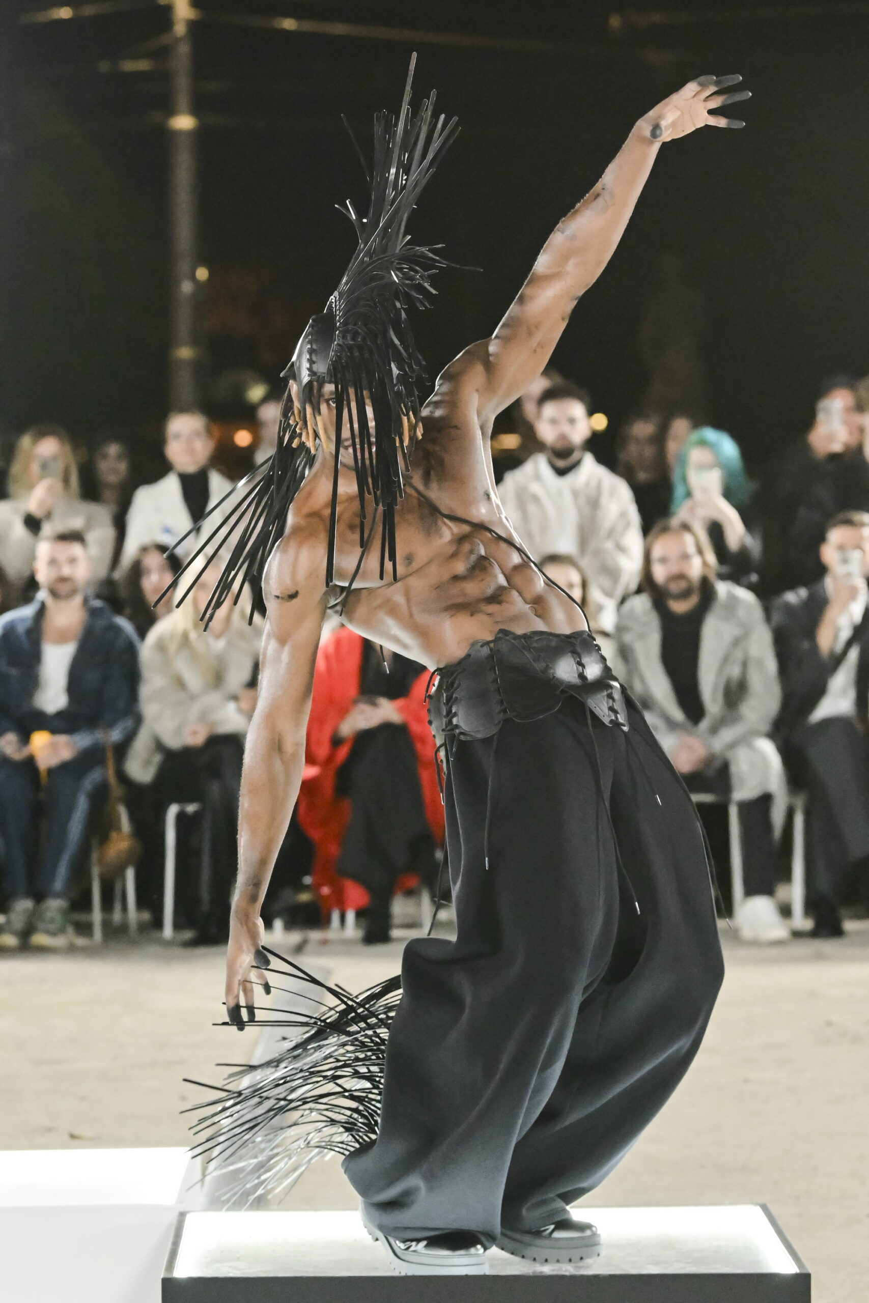 Models on a chessboard-inspired runway during Mercedes-Benz Fashion Live! 2024