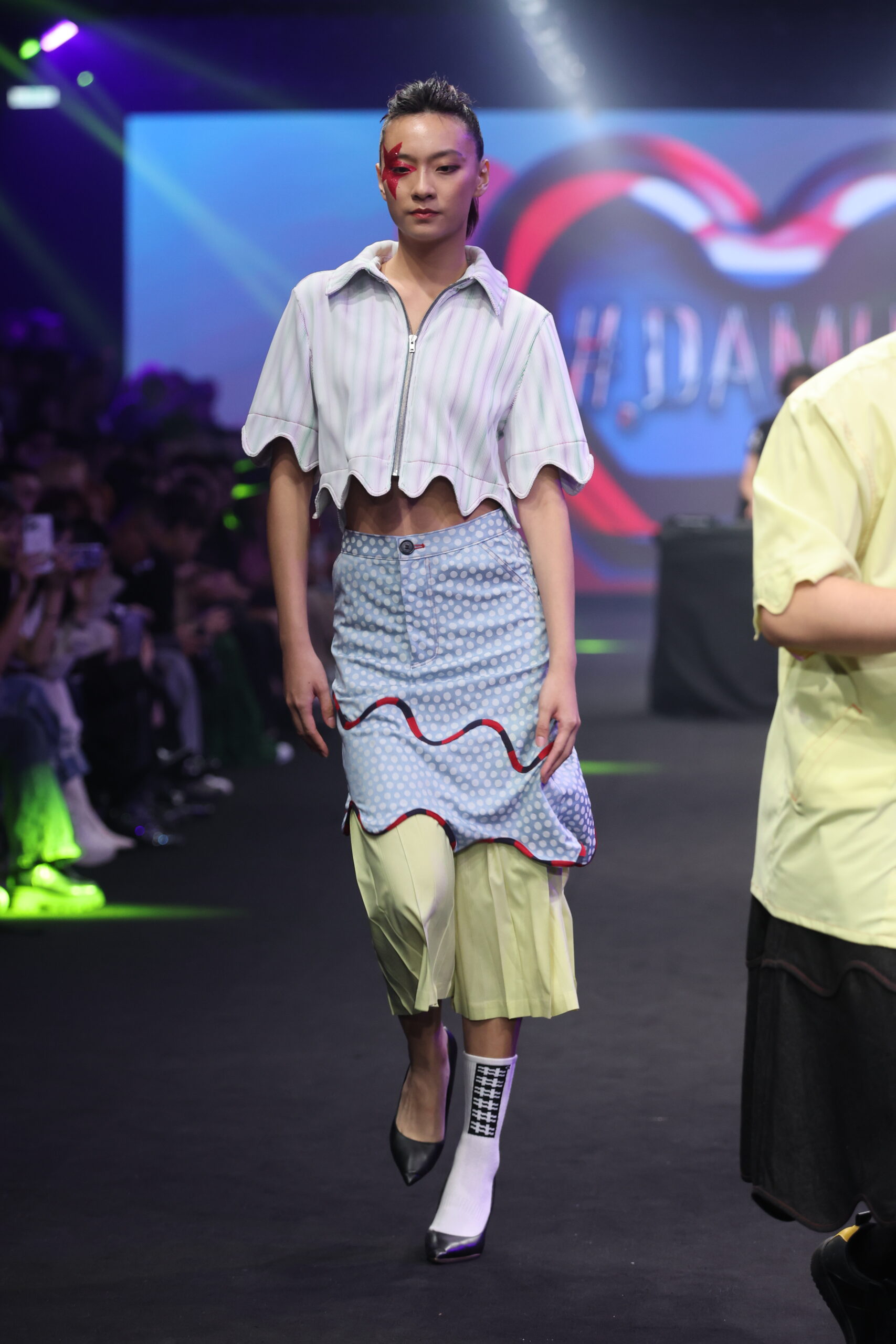 Model showcasing a gender-fluid outfit from #DAMUR's SS25 collection, inspired by love and upcycled fashion