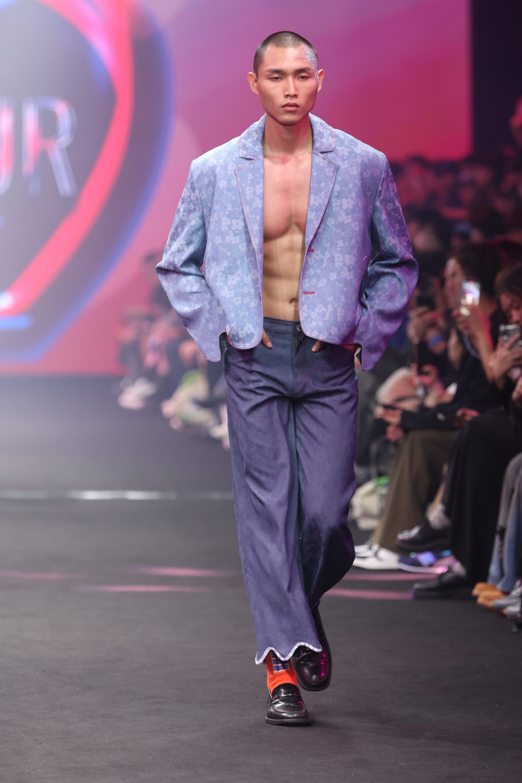 Model showcasing a gender-fluid outfit from #DAMUR's SS25 collection, inspired by love and upcycled fashion