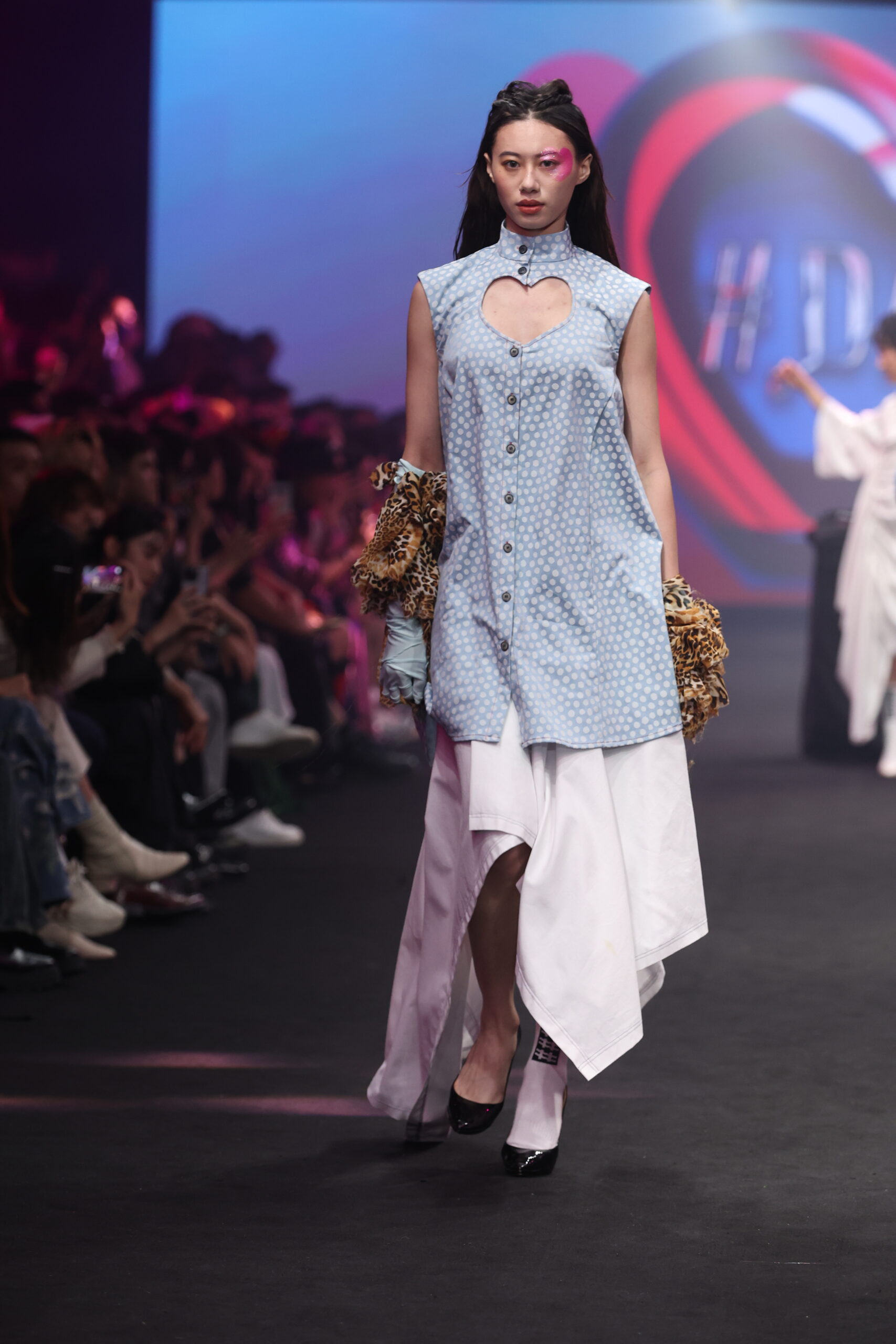 Model showcasing a gender-fluid outfit from #DAMUR's SS25 collection, inspired by love and upcycled fashion