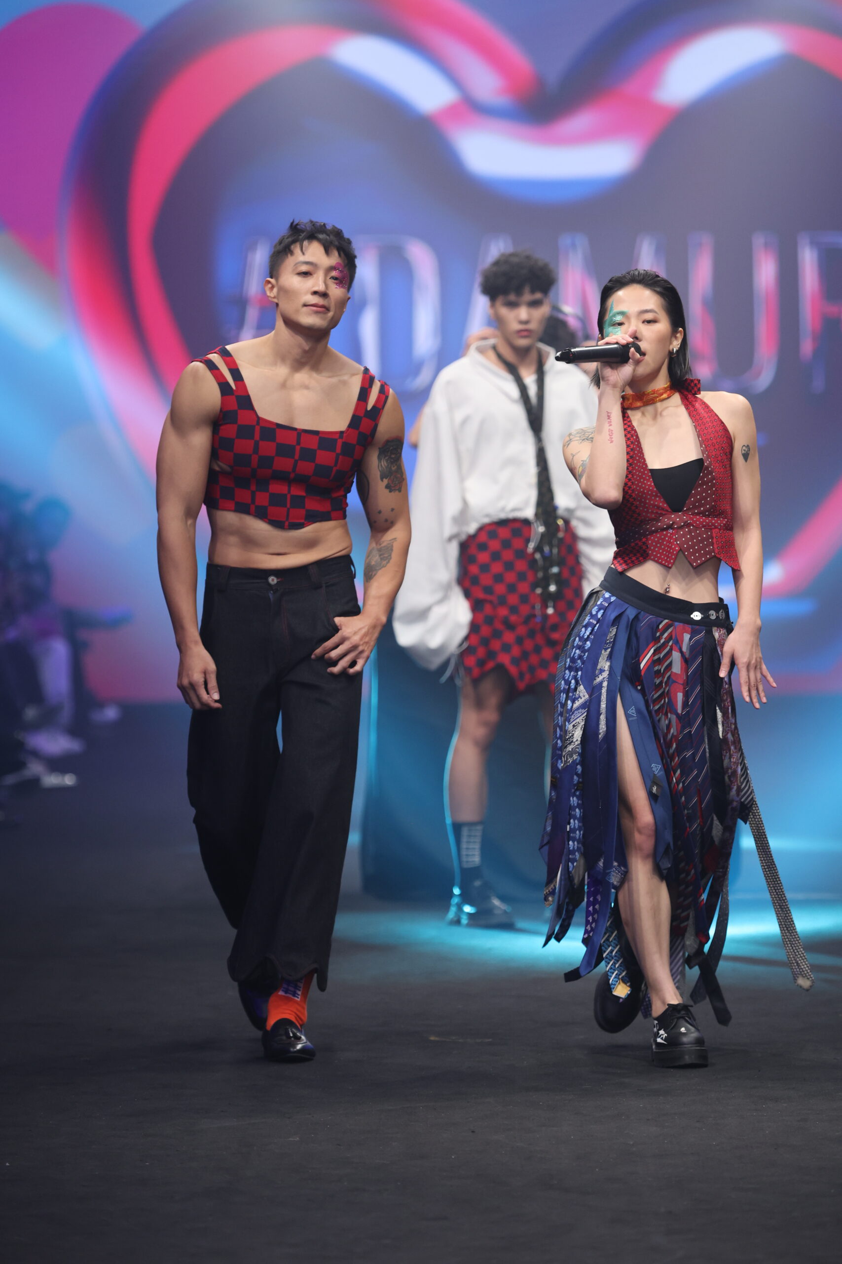 Model showcasing a gender-fluid outfit from #DAMUR's SS25 collection, inspired by love and upcycled fashion