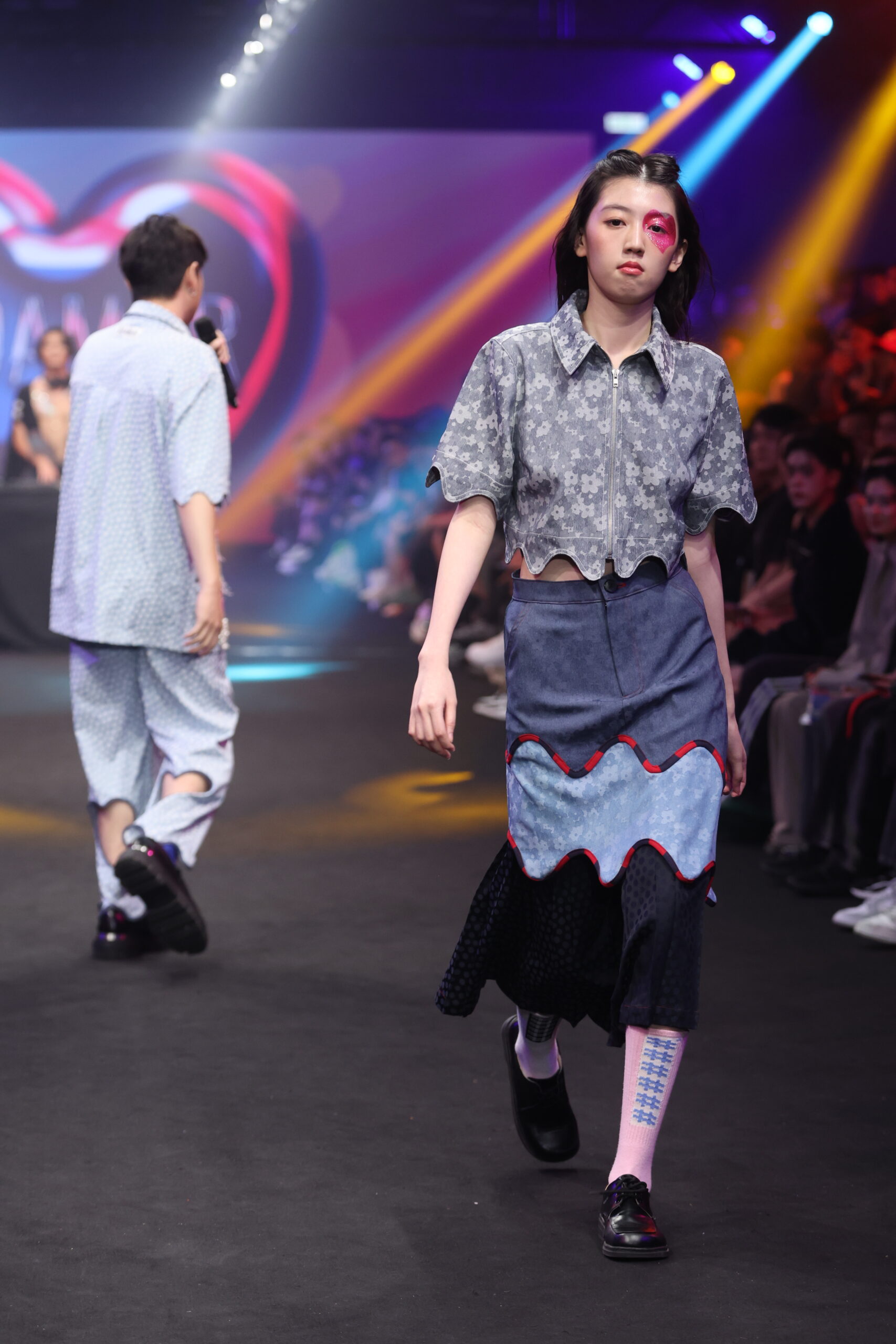 Model showcasing a gender-fluid outfit from #DAMUR's SS25 collection, inspired by love and upcycled fashion