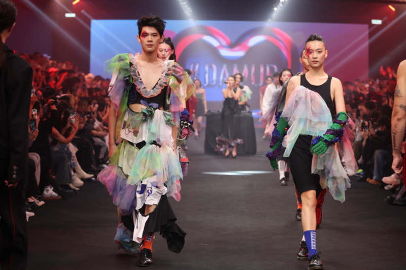 Model showcasing a gender-fluid outfit from #DAMUR's SS25 collection, inspired by love and upcycled fashion
