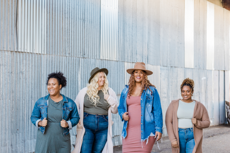 A group of Plus-size models on the runway, showcasing inclusive fashion trends at Fashion Week.