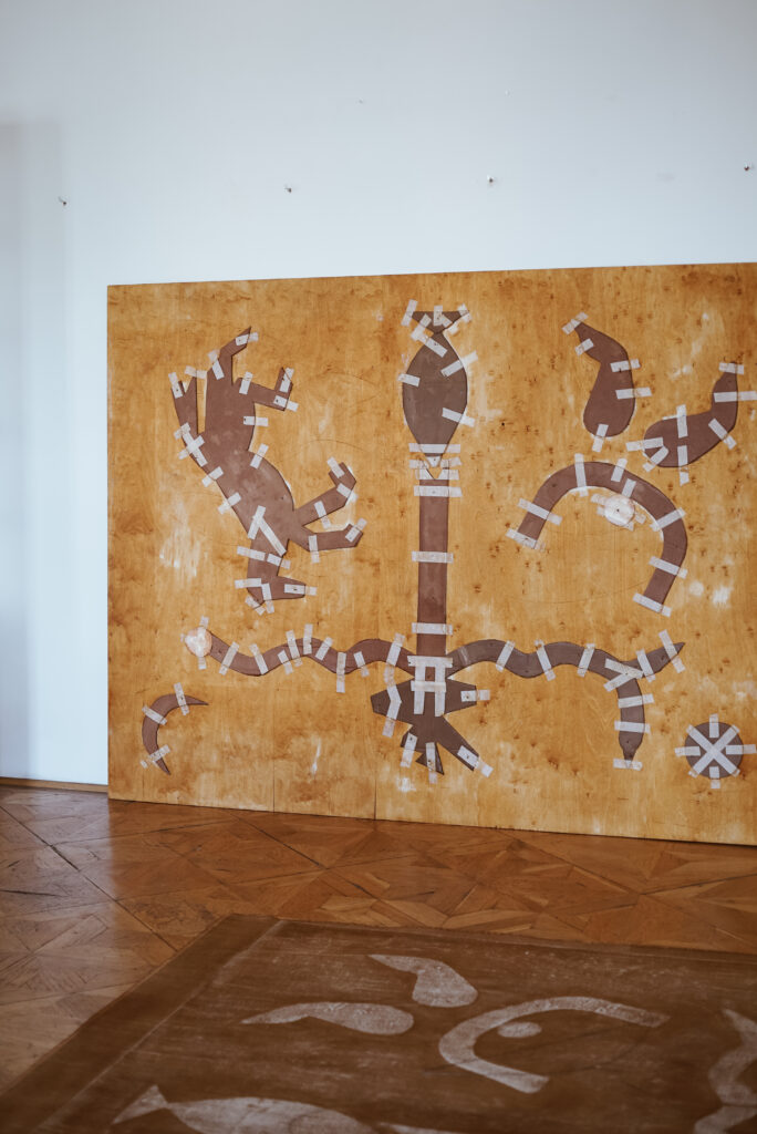 Santa Gaia Pilens' large-scale mixed media piece featuring symbolic elements from the Tree of Life and ancient archetypes.