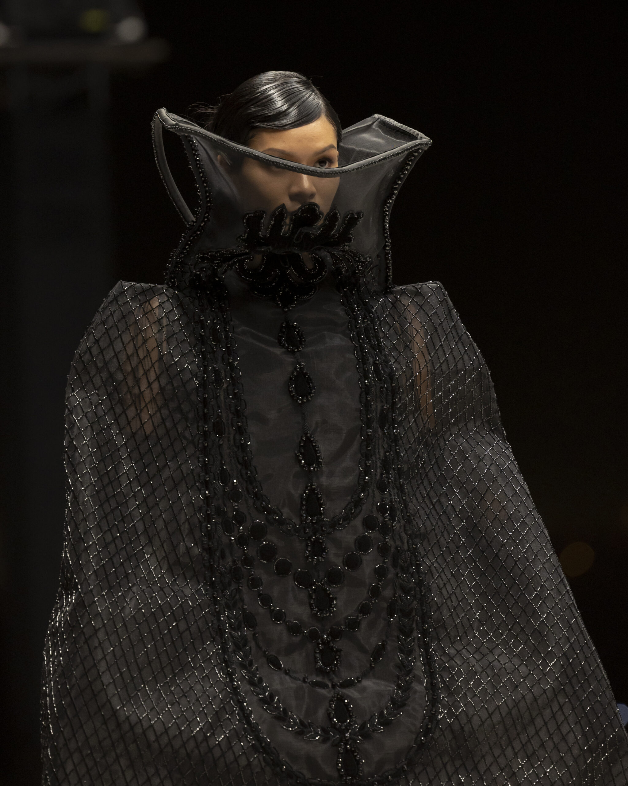 Models showcasing Saudi couture at Riyadh Fashion Week, blending tradition and modernity.