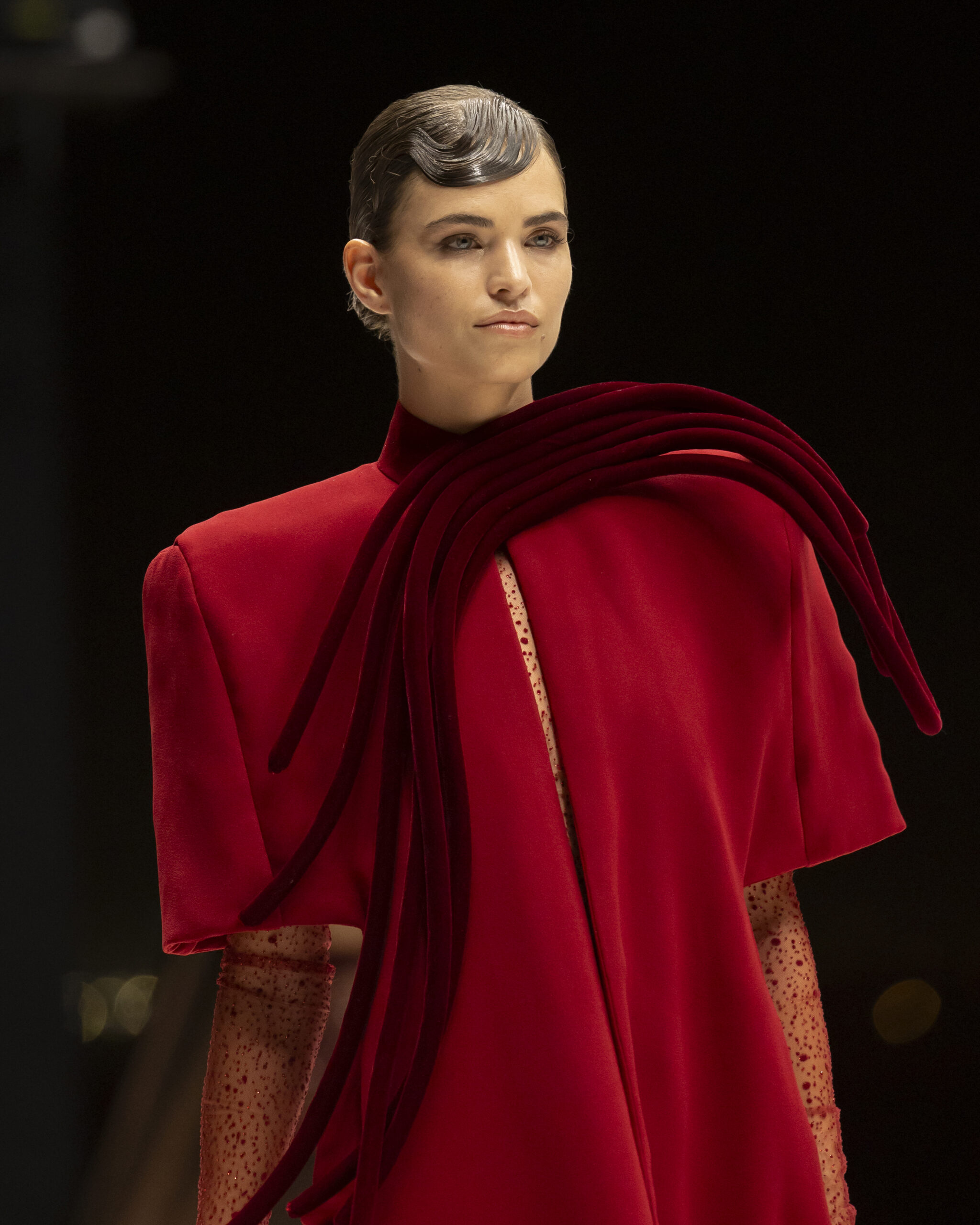 Models showcasing Saudi couture at Riyadh Fashion Week, blending tradition and modernity.